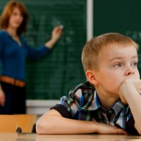 Distracted Student in Classroom --- Image by © Wolfgang Flamisch/Corbis